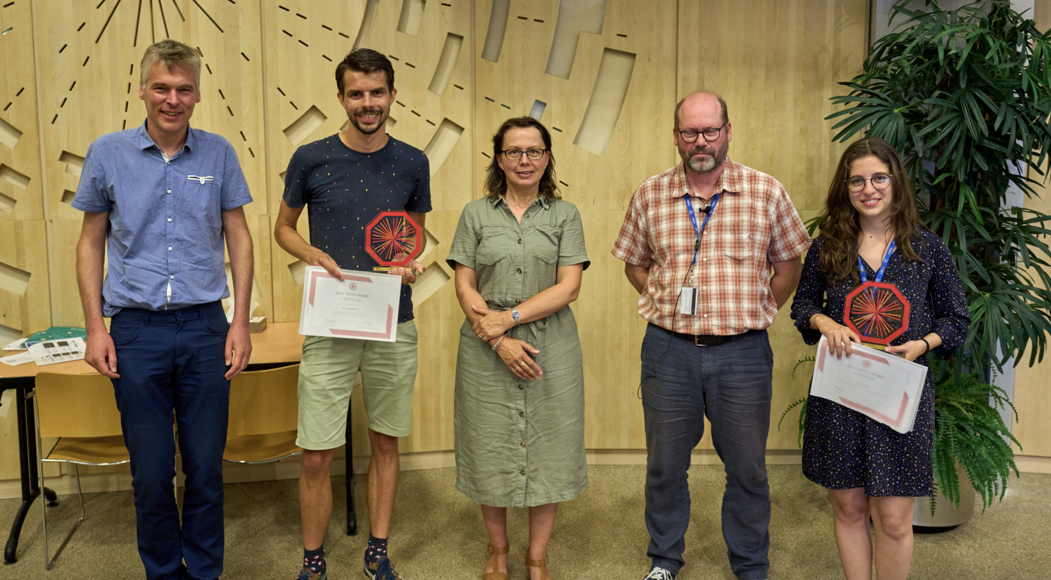 ALICE Thesis Award winners pose with their awards.